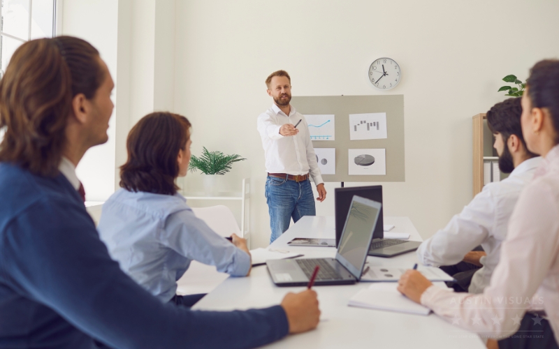 business meeting presentation team reviewing charts