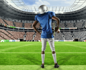 football player in blue uniform on field facing crowd