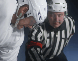 ice hockey player and referee ready for faceoff