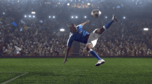 soccer player bicycle kick during night stadium match
