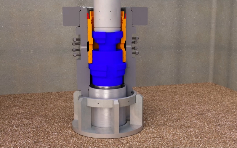 3D visualization of a wellhead system highlighting internal components in blue and orange designed to illustrate functionality and assembly details