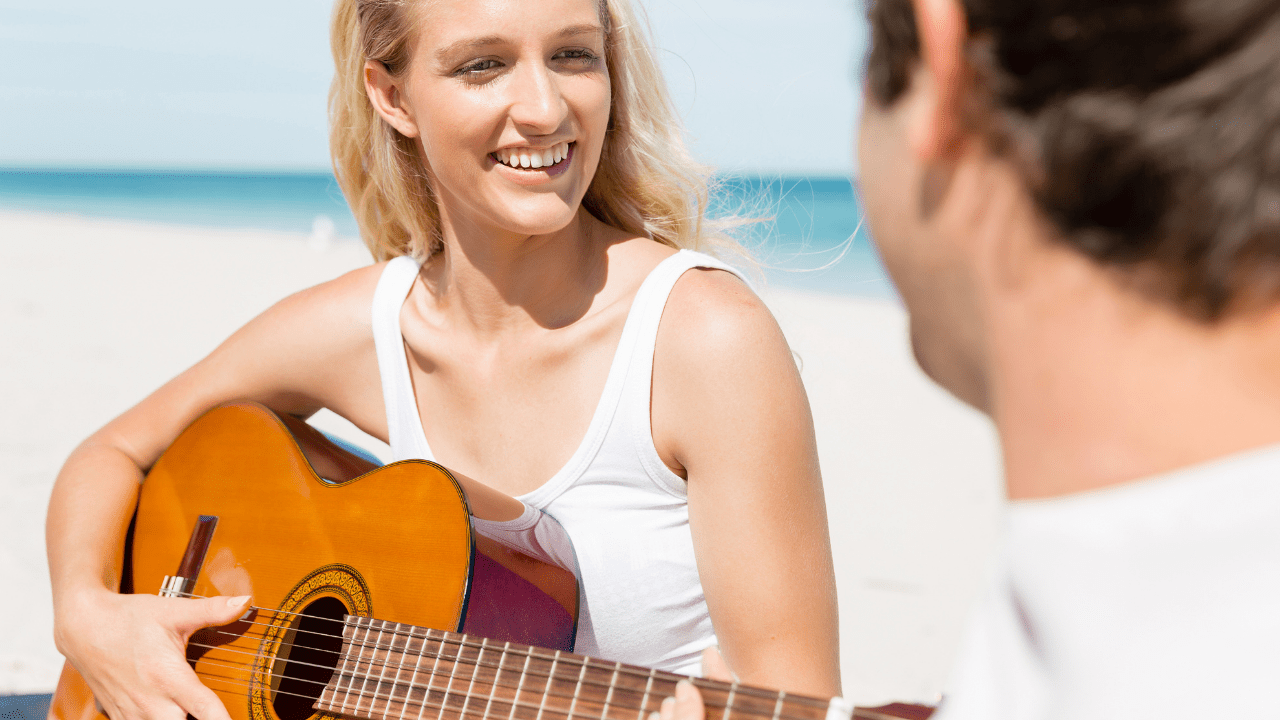 Animated music video girl holding a guitar telling her partner how is her experience at the beach