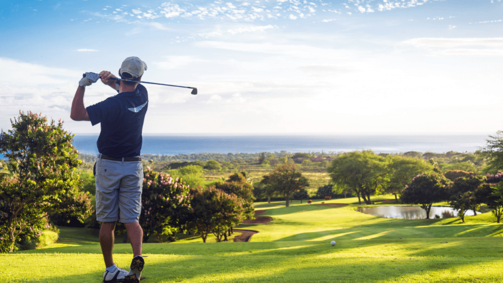 man playing golf looking at a great view of the golf course where he needs to hit the target of the ball